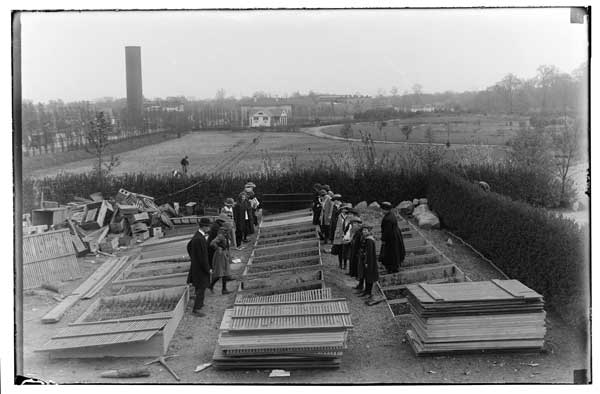 Erasmus Hall High School.
Class in applied botany- studying cold frame work with F. Stoll.  Miss Mabel Young in charge.