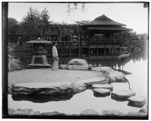 Japanese Garden.  
Tea house from W. shore.  Native woman in costume on island.