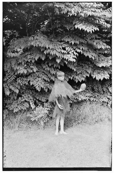 Coconut.
Fibre raincoat.  
Margaret V. F. Stoll, posing.
