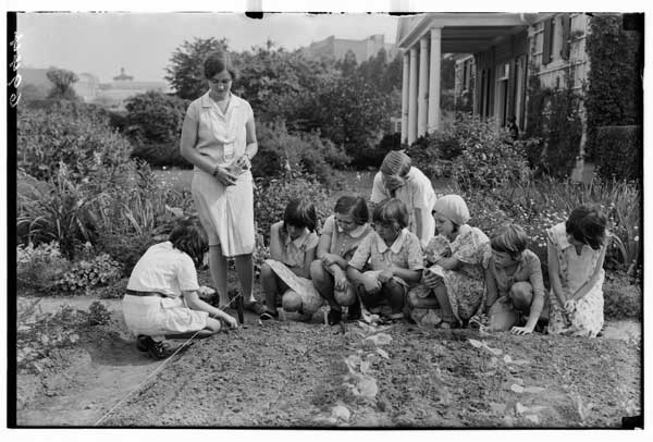 Children's Garden.  First lesson in planting, 1930.  Miss Jenkins in charge.